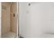A tiled shower stall with a glass door in a bathroom with clean, neutral decor at 3137 East St, Oviedo, FL 32765