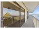 Balcony with expansive waterfront view through large sliding glass door at 3216 John Anderson Dr, Ormond Beach, FL 32176
