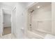 Bathroom featuring a bright, clean shower-tub combination and a view to an adjacent room at 3216 John Anderson Dr, Ormond Beach, FL 32176