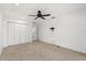 A bedroom includes double closets and a doorway to another room at 3216 John Anderson Dr, Ormond Beach, FL 32176