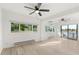 Spacious living room with hardwood floors and large windows offering scenic views at 3216 John Anderson Dr, Ormond Beach, FL 32176