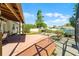 Backyard featuring a covered patio, decorative pond, and lush landscaping against a clear blue sky at 4705 Beggs Rd, Orlando, FL 32810