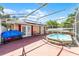 Backyard patio featuring exterior access, spa, and room for patio furniture at 4705 Beggs Rd, Orlando, FL 32810
