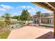 Beautiful backyard with a decorative pond, screened enclosure, and pool offering a tranquil outdoor space at 4705 Beggs Rd, Orlando, FL 32810