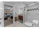 Bright bathroom with tile flooring, a walk-in shower, and neutral walls at 4705 Beggs Rd, Orlando, FL 32810