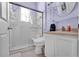 Modern bathroom featuring a glass shower, sleek fixtures, and neutral tiling at 4705 Beggs Rd, Orlando, FL 32810