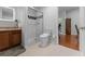 Clean bathroom with a modern walk-in shower, neutral tile, and a sleek vanity at 4705 Beggs Rd, Orlando, FL 32810