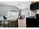 Bedroom with day bed, chair, ceiling fan, and direct access to exterior via French doors at 4705 Beggs Rd, Orlando, FL 32810
