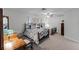 Charming bedroom featuring two beds with ornate frames and light-colored walls at 4705 Beggs Rd, Orlando, FL 32810