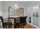 Cozy dining area features a round table, two bar stools, and a decorative overhead light at 4705 Beggs Rd, Orlando, FL 32810