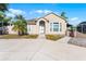 Exterior shot of the front of the home with manicured landscaping and charming architecture at 4705 Beggs Rd, Orlando, FL 32810