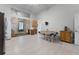 Open kitchen with tile floors, plenty of cabinet space, and an adjacent dining area at 4705 Beggs Rd, Orlando, FL 32810