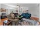 Spacious living room with stylish furniture, ceiling fan, and a large area rug at 4705 Beggs Rd, Orlando, FL 32810
