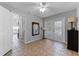 Living area with ceiling fan, tiled flooring, French doors and view to other rooms at 4705 Beggs Rd, Orlando, FL 32810