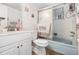 Practical bathroom featuring a tiled shower with sliding door, toilet, and vanity with sink at 4723 Cherokee Rose Dr, Orlando, FL 32808