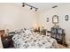 A functional bedroom with a queen size bed, dark furniture, and track lighting at 4723 Cherokee Rose Dr, Orlando, FL 32808