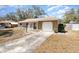 Charming home with an attached garage and a well-maintained driveway at 4723 Cherokee Rose Dr, Orlando, FL 32808