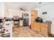 Functional kitchen with stainless steel appliances, tile floors, and ample counter space at 4723 Cherokee Rose Dr, Orlando, FL 32808