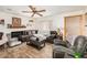 Cozy living room featuring tile floors, a ceiling fan, and abundant natural light at 4723 Cherokee Rose Dr, Orlando, FL 32808