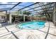 Screened in pool with steps, view of patio, grill and outdoor furniture at 4723 Cherokee Rose Dr, Orlando, FL 32808