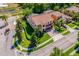 Aerial view of the home showcasing mature trees, landscaping and three car garage at 4932 Eastlake Vista Dr, St Cloud, FL 34771