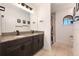 Bathroom with granite countertop, double vanity, and tile floors at 4932 Eastlake Vista Dr, St Cloud, FL 34771