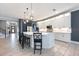 Beautiful kitchen with white cabinets, a center island with seating, and stainless steel appliances at 4932 Eastlake Vista Dr, St Cloud, FL 34771
