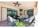 Inviting covered patio with comfortable seating around a cozy fire pit, perfect for outdoor entertaining at 4932 Eastlake Vista Dr, St Cloud, FL 34771