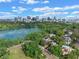 Breathtaking aerial view of city skyline with lakefront homes nestled among lush trees and a scenic lakeside at 511 Woodlawn Blvd, Orlando, FL 32801