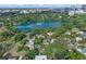 Amazing aerial view shows the property nestled amongst mature trees, close to a lake and downtown area at 511 Woodlawn Blvd, Orlando, FL 32801