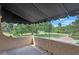 Spacious covered balcony with views of a large open green space creates a private and calming outdoor retreat at 511 Woodlawn Blvd, Orlando, FL 32801