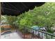 Overhead view of the balcony, the outdoor seating area with a fire pit, and the sparkling blue swimming pool below at 511 Woodlawn Blvd, Orlando, FL 32801