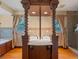 Beautiful bathroom with decorative columns, a marble countertop, and a luxurious bathtub at 511 Woodlawn Blvd, Orlando, FL 32801