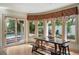 Dining area with views of the pool and hardwood floors at 511 Woodlawn Blvd, Orlando, FL 32801