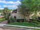 Stunning two-story home with lush landscaping, brick driveway, and charming architectural details at 511 Woodlawn Blvd, Orlando, FL 32801