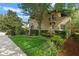 Lovely landscaped home featuring a balcony and a well-manicured lawn at 511 Woodlawn Blvd, Orlando, FL 32801