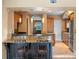 Kitchen featuring granite countertops, island with seating, and pendant lighting at 511 Woodlawn Blvd, Orlando, FL 32801