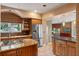 Open kitchen with granite countertops, stainless steel appliances and tile flooring at 511 Woodlawn Blvd, Orlando, FL 32801