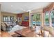 Living room with hardwood floors, access to a pool, and a view of the yard at 511 Woodlawn Blvd, Orlando, FL 32801