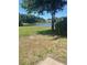 Beautiful view of the lake from the grassy backyard at 526 Seasons Ct, Winter Springs, FL 32708