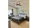 Comfortable carpeted bedroom with a large window, ceiling fan, and decorative dream catcher above the bed at 526 Seasons Ct, Winter Springs, FL 32708