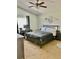 Comfortable carpeted bedroom with a large window, ceiling fan, and decorative dream catcher above the bed at 526 Seasons Ct, Winter Springs, FL 32708