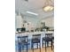 Open kitchen with stainless steel appliances, breakfast bar seating, and ample counter space at 526 Seasons Ct, Winter Springs, FL 32708