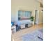 Relaxing living room space with wood floors, a mounted TV, and decorative accents at 526 Seasons Ct, Winter Springs, FL 32708