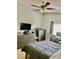 Cozy bedroom featuring tall ceilings, a ceiling fan, carpet flooring, and warm natural lighting at 526 Seasons Ct, Winter Springs, FL 32708