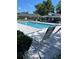 Community pool featuring lounge chairs and a covered seating area at 526 Seasons Ct, Winter Springs, FL 32708