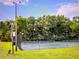 Enjoy a match on this private tennis court with mature tree backdrop for a scenic playing experience at 526 Seasons Ct, Winter Springs, FL 32708