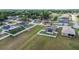 Aerial view of a home with a fenced backyard, in a neighborhood with lush greenery at 5707 Fischer Dr, Lakeland, FL 33812