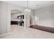 Bright dining area featuring tile floors, chandelier and arched entry to kitchen at 5707 Fischer Dr, Lakeland, FL 33812