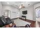 Vaulted ceiling living room with dark wood floors, fan, and seamless transition to other rooms at 5707 Fischer Dr, Lakeland, FL 33812